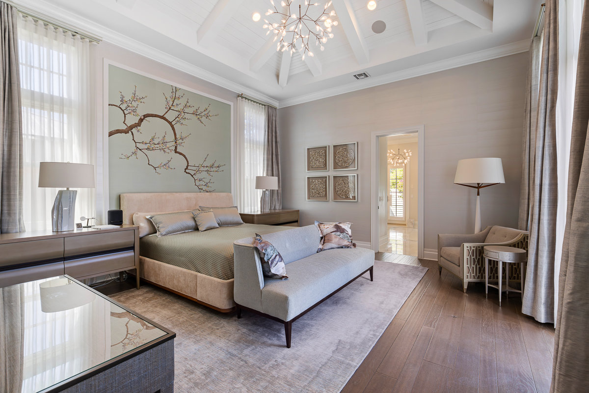 bedroom with furniture and lit chandelier